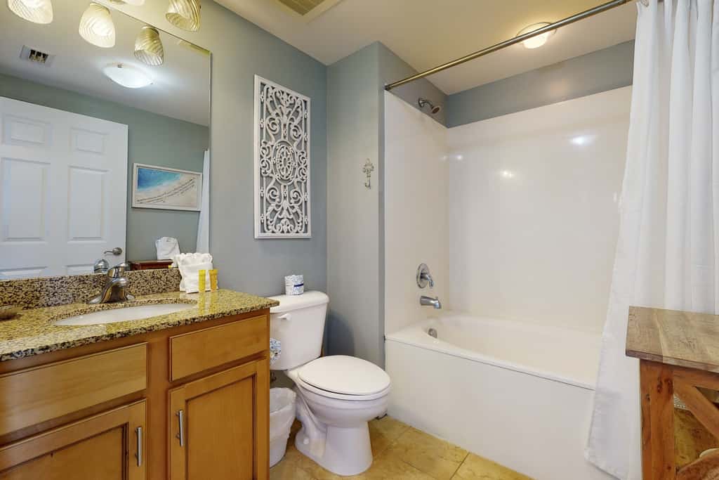 Water-view 11th-floor condo with hot tub, heated pool, tennis, sauna, gym, W/D