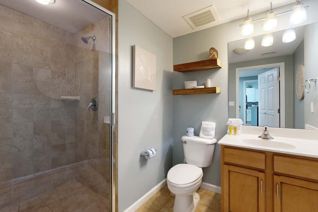 Water-view 11th-floor condo with hot tub, heated pool, tennis, sauna, gym, W/D