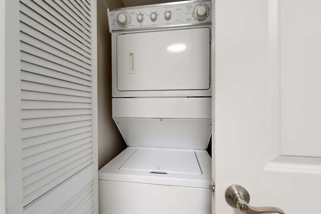 Water-view 11th-floor condo with hot tub, heated pool, tennis, sauna, gym, W/D
