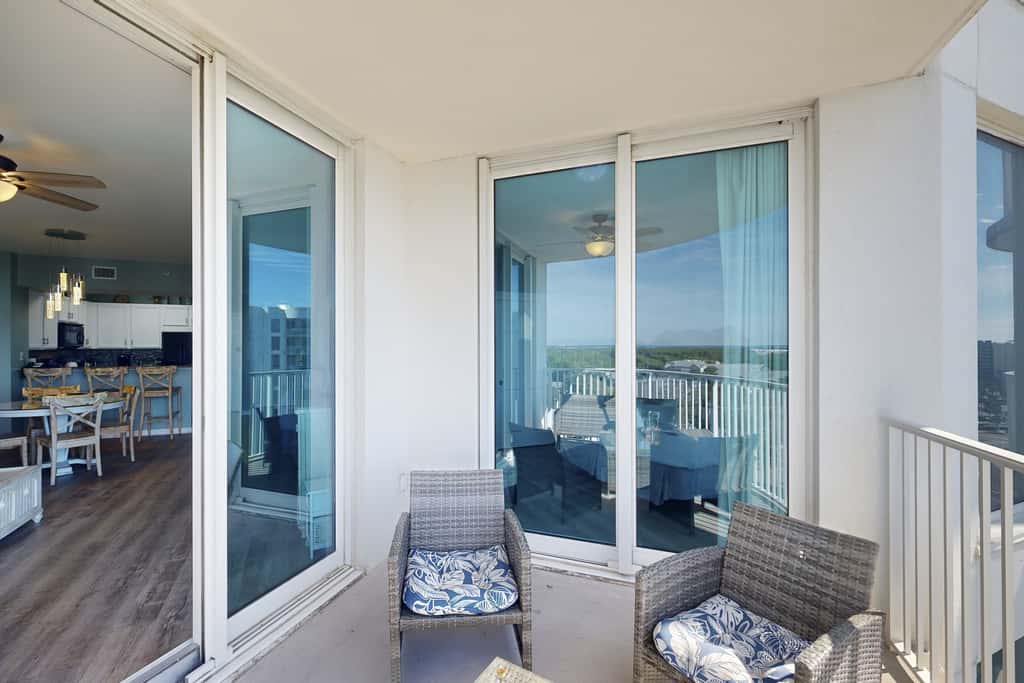 Water-view 11th-floor condo with hot tub, heated pool, tennis, sauna, gym, W/D