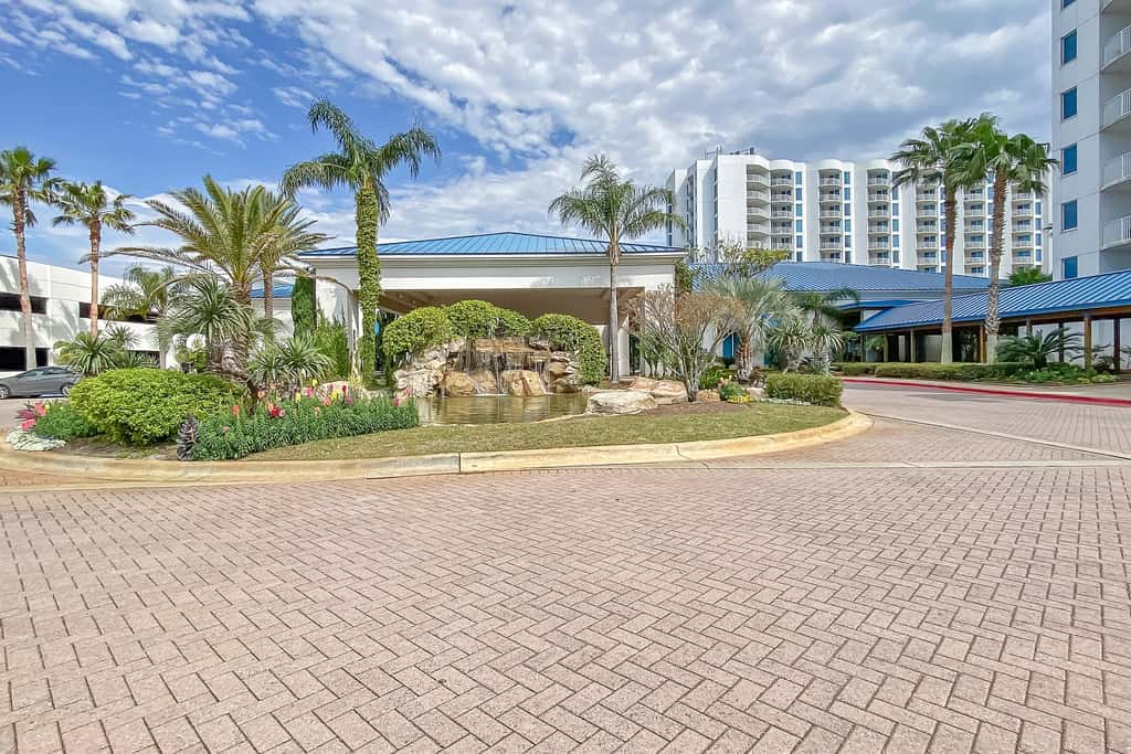 Water-view 11th-floor condo with hot tub, heated pool, tennis, sauna, gym, W/D