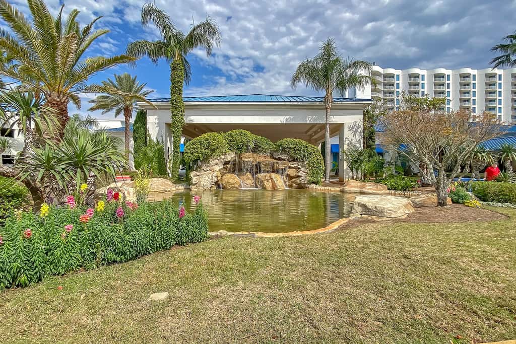 Water-view 11th-floor condo with hot tub, heated pool, tennis, sauna, gym, W/D
