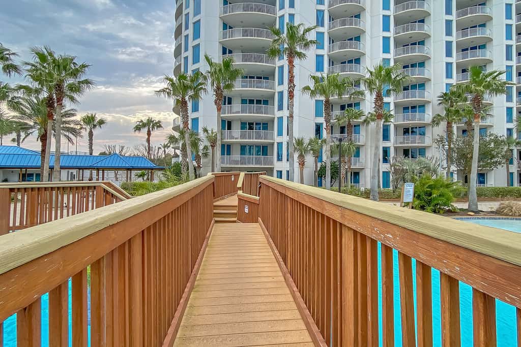 Water-view 11th-floor condo with hot tub, heated pool, tennis, sauna, gym, W/D