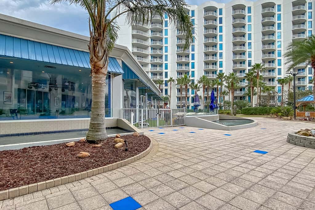 Water-view 11th-floor condo with hot tub, heated pool, tennis, sauna, gym, W/D