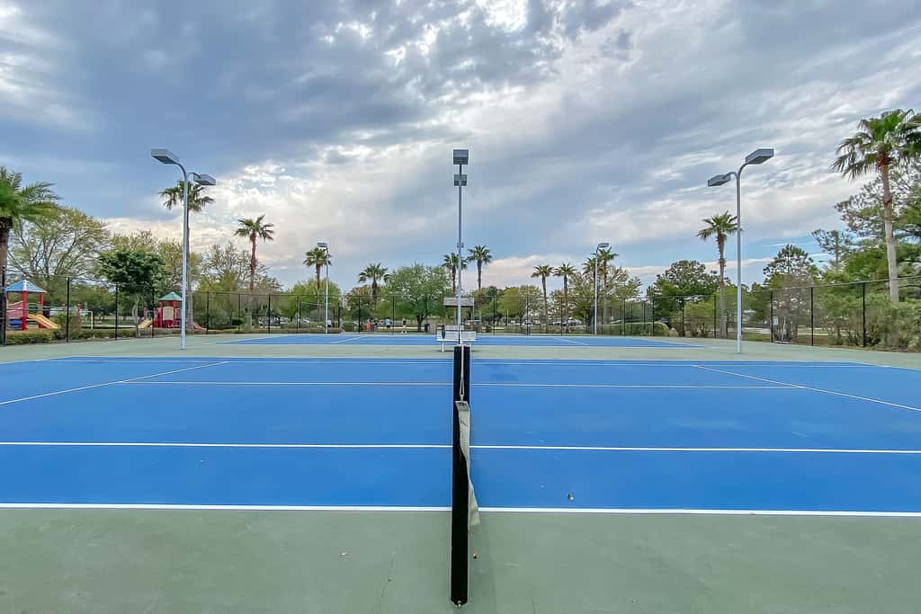 Water-view 11th-floor condo with hot tub, heated pool, tennis, sauna, gym, W/D