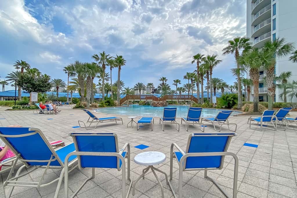 Water-view 11th-floor condo with hot tub, heated pool, tennis, sauna, gym, W/D