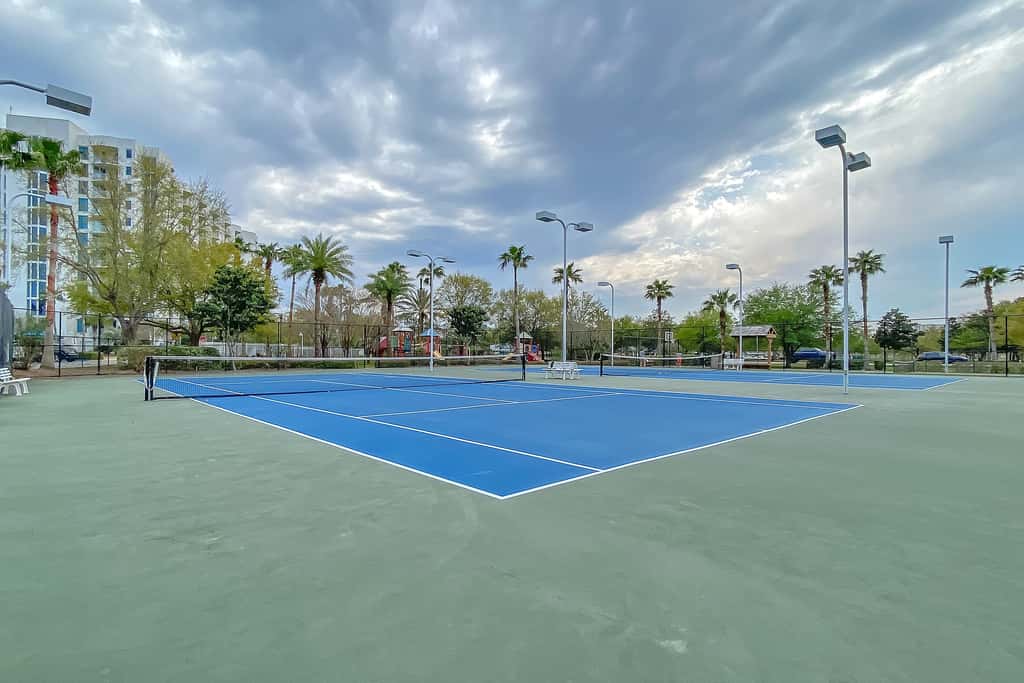 Water-view 11th-floor condo with hot tub, heated pool, tennis, sauna, gym, W/D