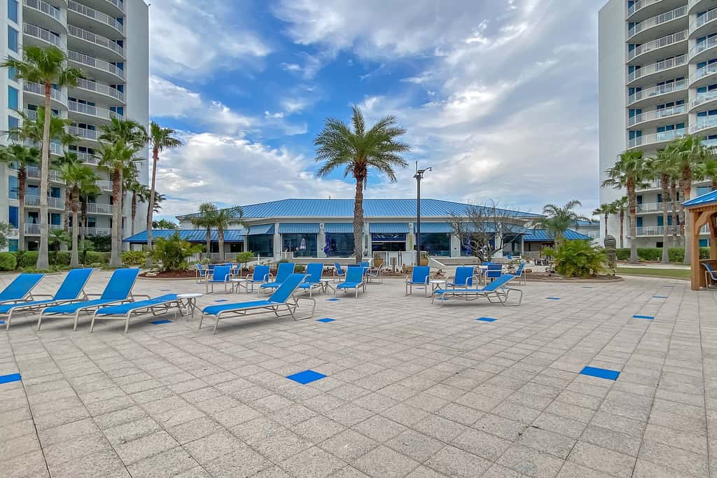 Water-view 11th-floor condo with hot tub, heated pool, tennis, sauna, gym, W/D