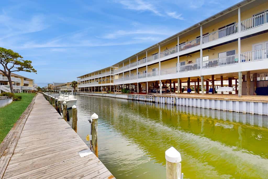 Inviting condo with dock, pool, hot tub & private beach - dog-friendly