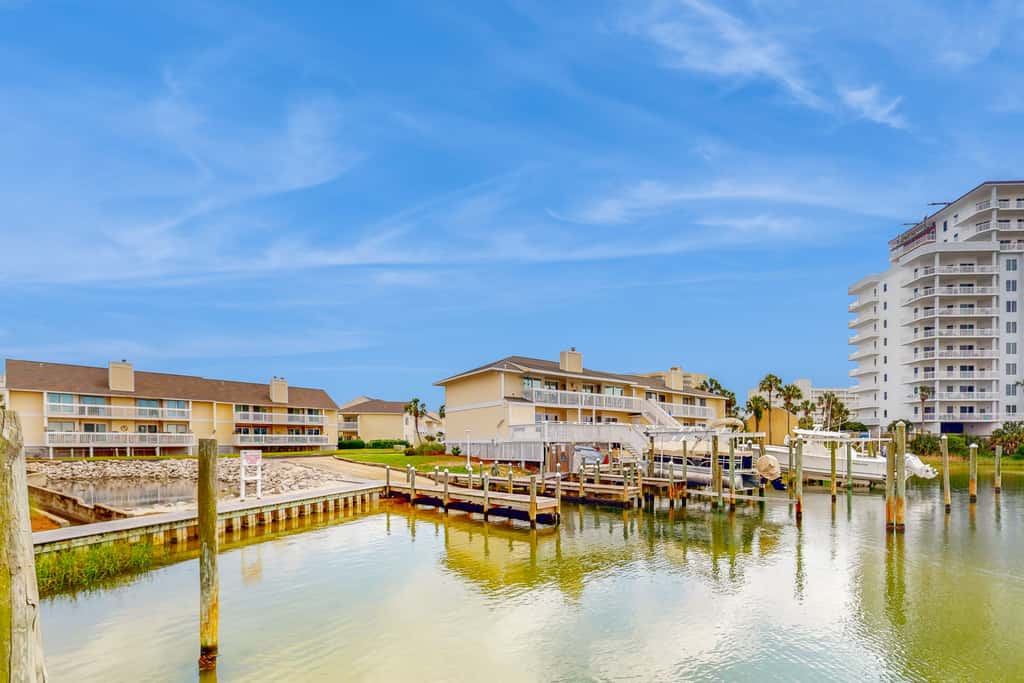 Inviting condo with dock, pool, hot tub & private beach - dog-friendly