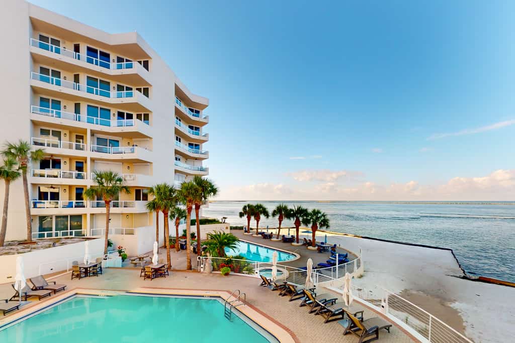 Ocean-view 2nd-floor condo with outdoor pool, gym, hot tub, balcony, W/D, AC