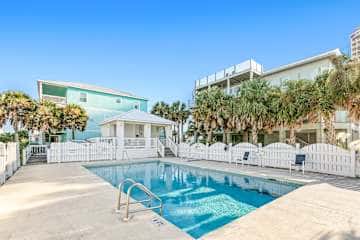 Stunning Beach Retreat with Shared Pool, Beach Access, Large Balcony & Gas Grill