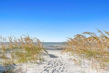 Stunning Beach Retreat with Shared Pool, Beach Access, Large Balcony & Gas Grill