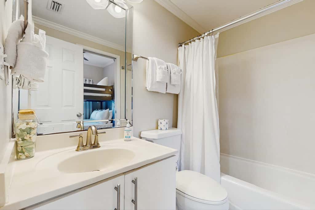 Stunning waterfront home with convenient beach access, pool & gym