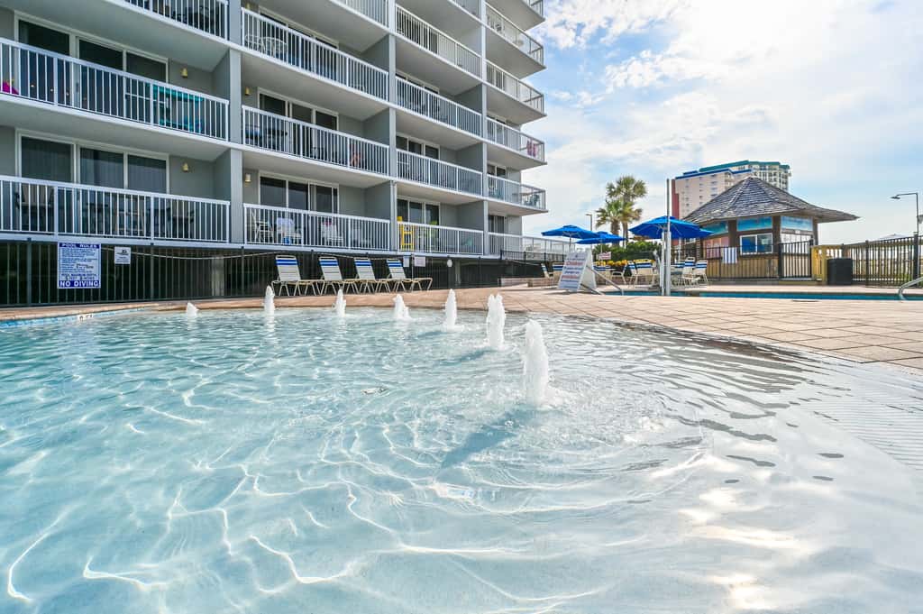 5th-floor condo with patio, pool & ocean views