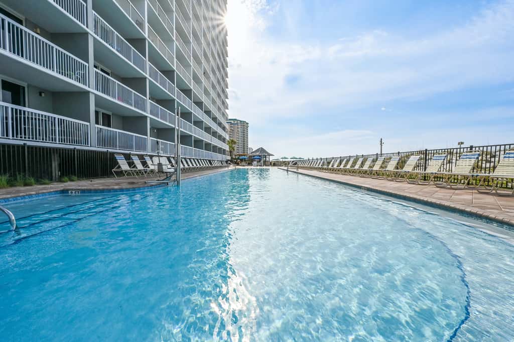 5th-floor condo with patio, pool & ocean views