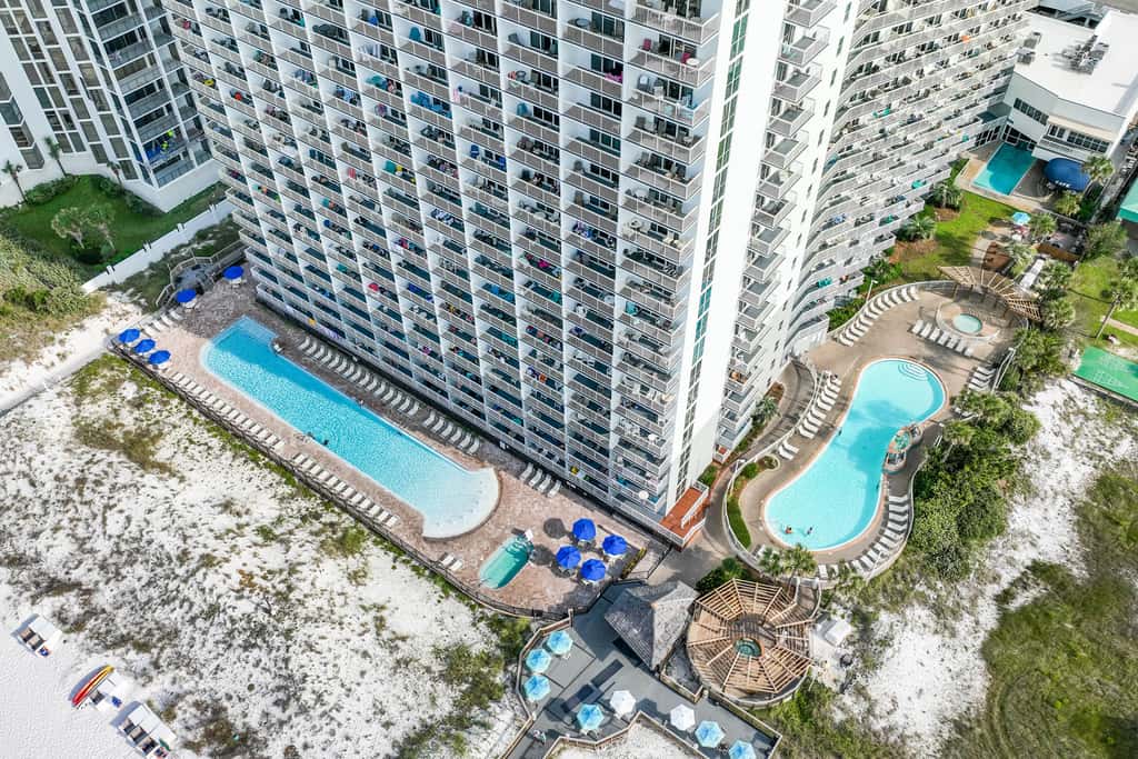 5th-floor condo with patio, pool & ocean views