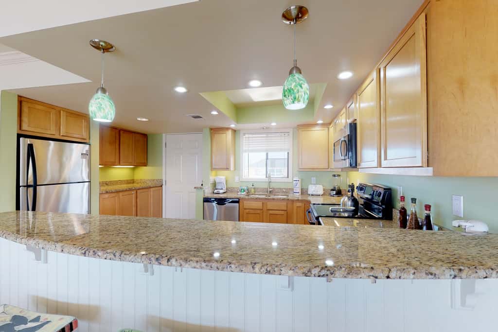 Beachfront condo with shared pool, hot tub, & fitness center plus beach access