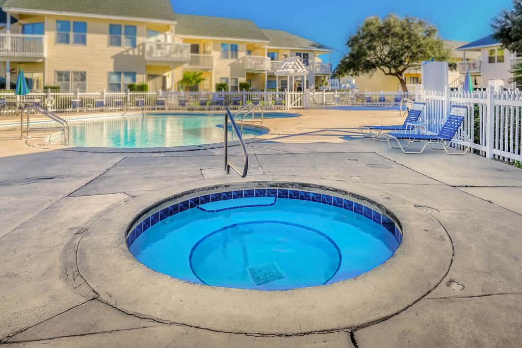 Central condo with five Pools, three hot tubs, beach access, & free golf access