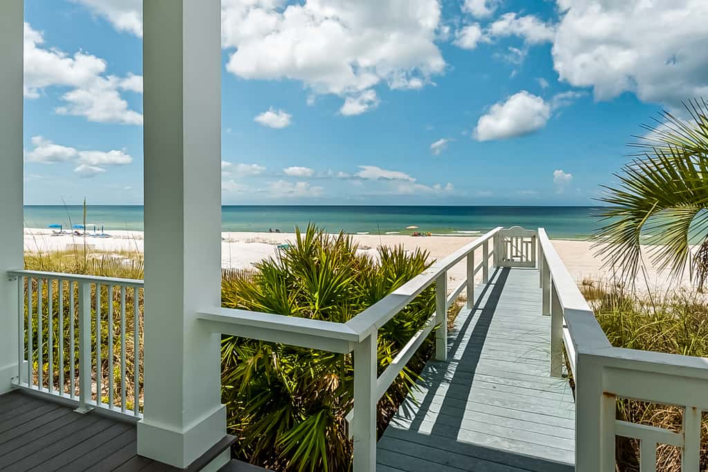 Spacious Gulf-front getaway with beach access, balcony views, a pool, & more