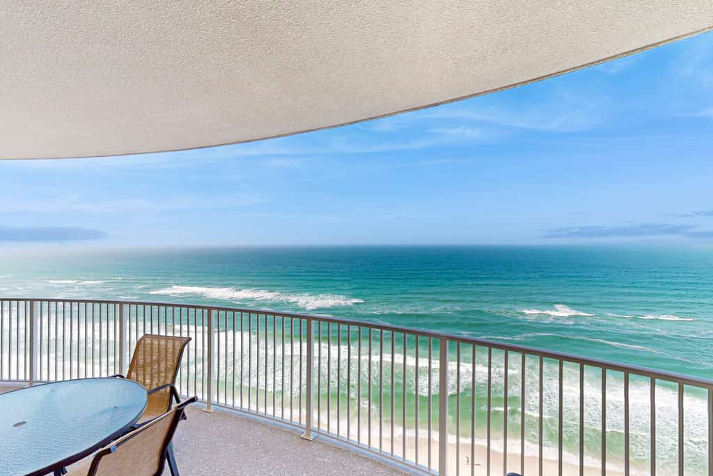 Spacious beachfront condo with full kitchen, shared pool and beach access!