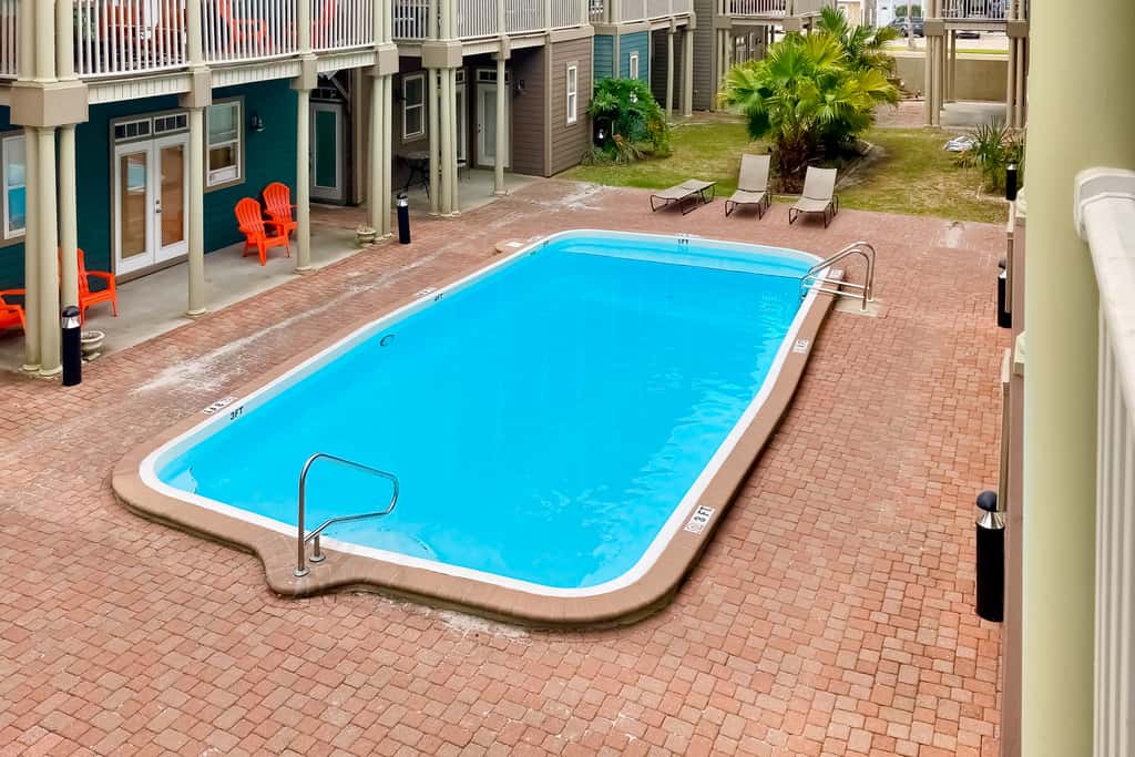 Dog-friendly home with balconies, foosball, pool access, & W&D - steps to beach