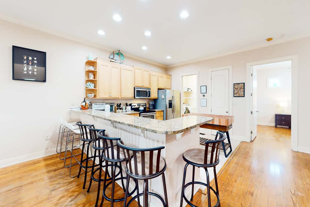Dog-friendly home with balconies, foosball, pool access, & W&D - steps to beach