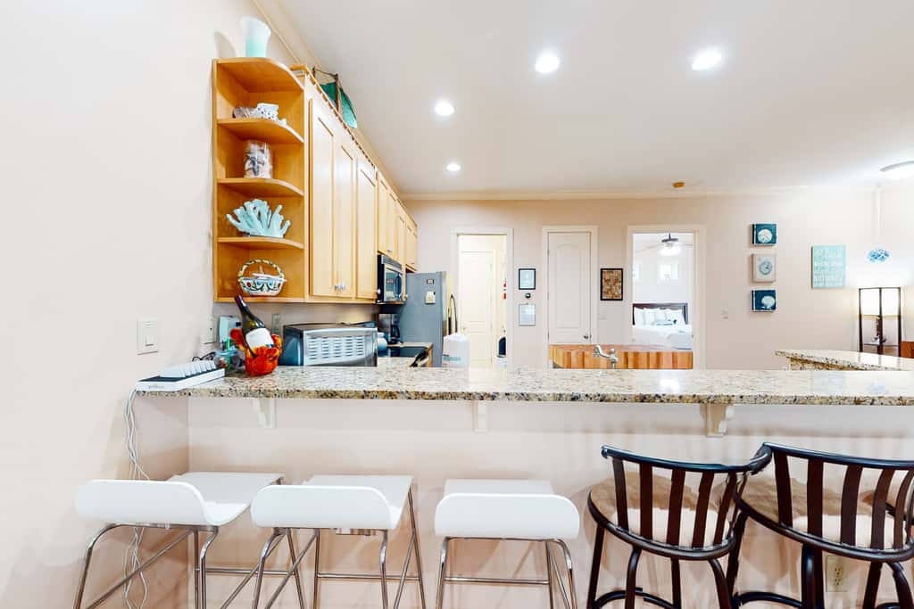Dog-friendly home with balconies, foosball, pool access, & W&D - steps to beach