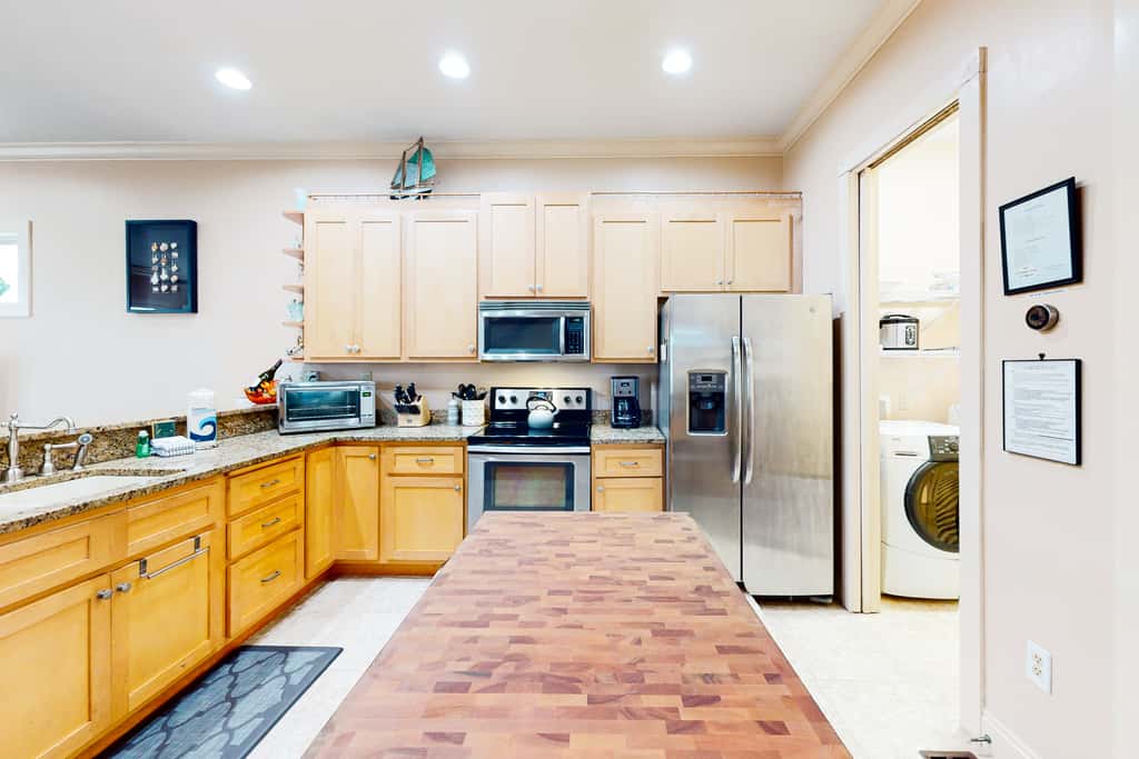 Dog-friendly home with balconies, foosball, pool access, & W&D - steps to beach