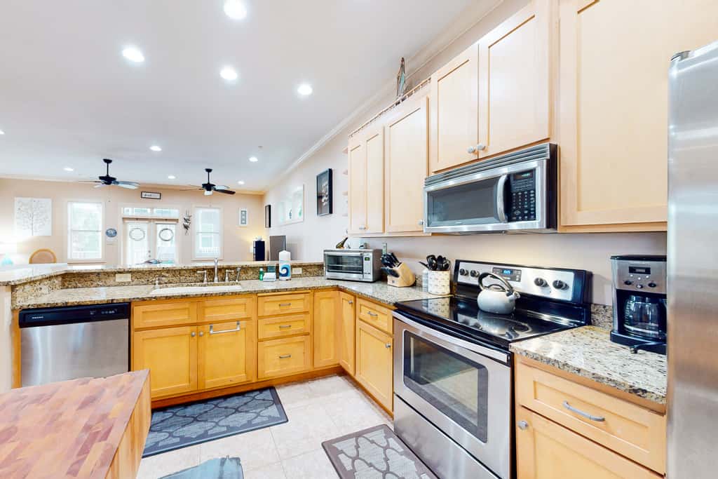 Dog-friendly home with balconies, foosball, pool access, & W&D - steps to beach