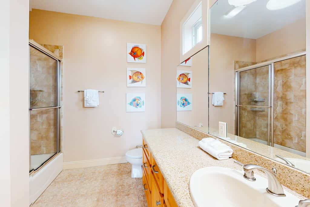 Dog-friendly home with balconies, foosball, pool access, & W&D - steps to beach