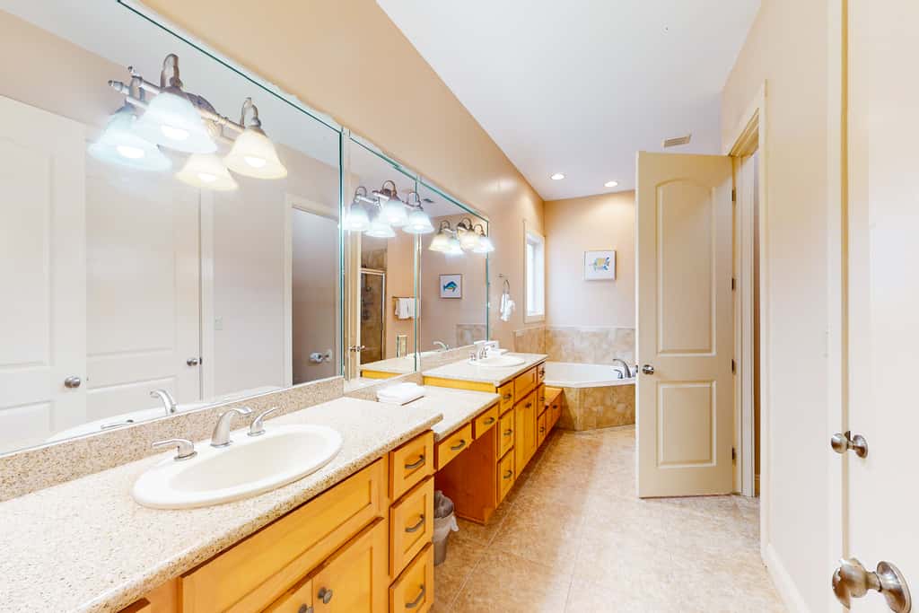 Dog-friendly home with balconies, foosball, pool access, & W&D - steps to beach