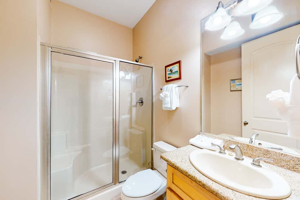 Dog-friendly home with balconies, foosball, pool access, & W&D - steps to beach