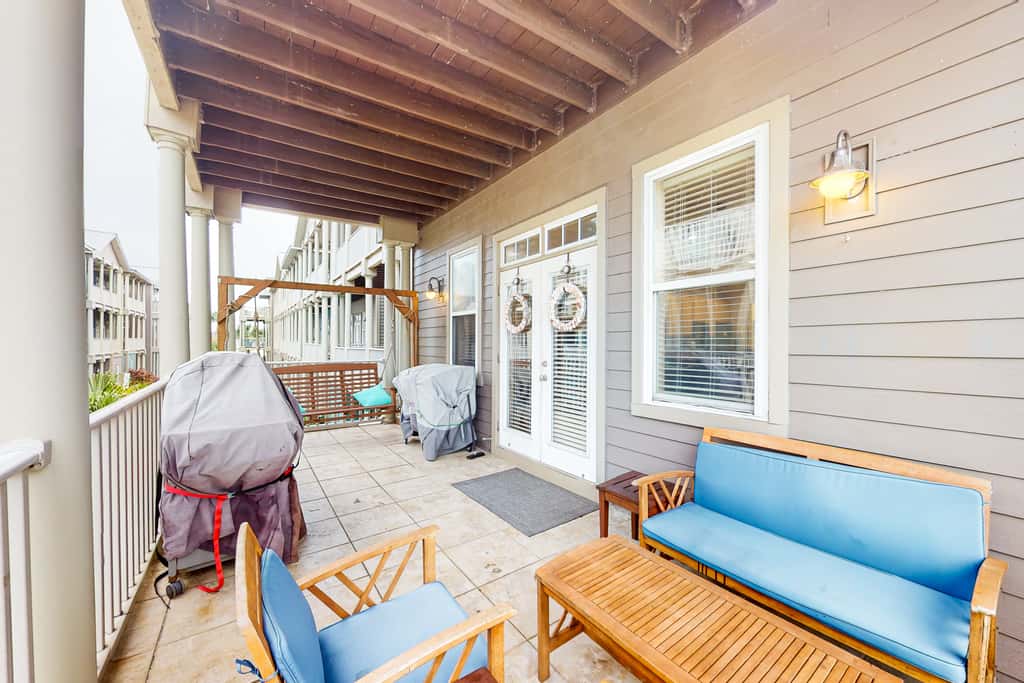 Dog-friendly home with balconies, foosball, pool access, & W&D - steps to beach