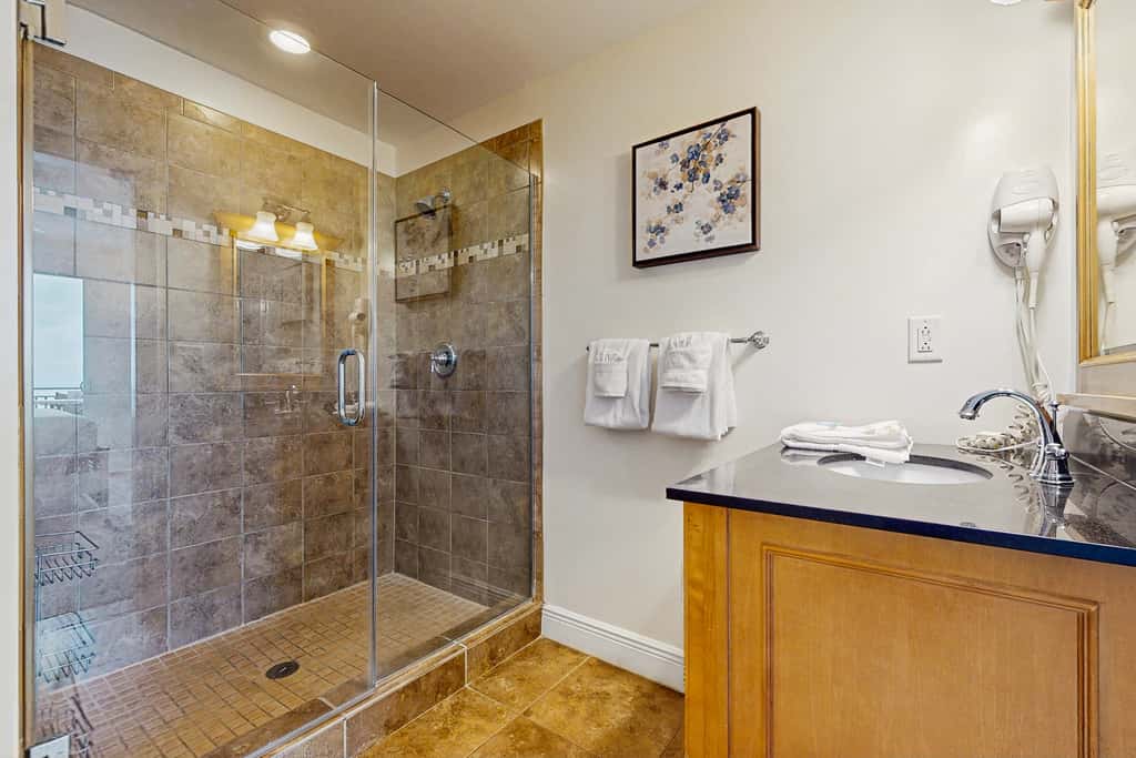 Updated beachfront retreat with hot tub, outdoor pool & balcony