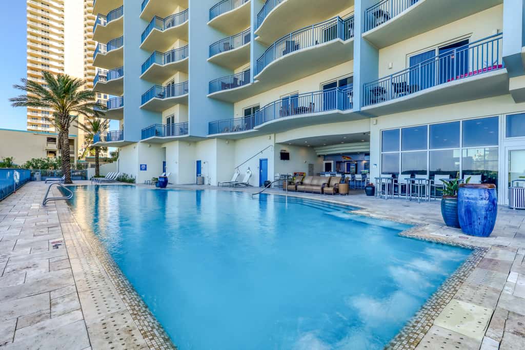 Updated beachfront retreat with hot tub, outdoor pool & balcony