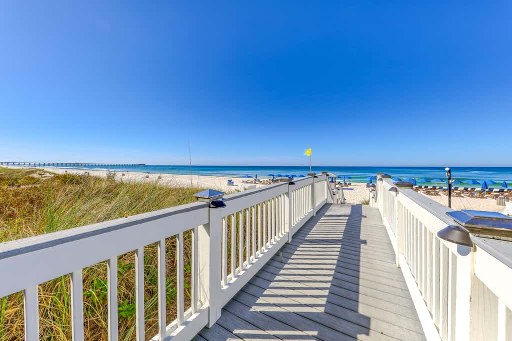 Updated beachfront retreat with hot tub, outdoor pool & balcony