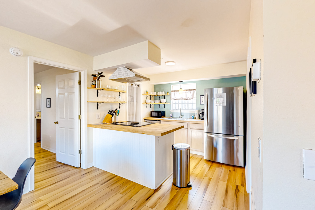 Updated home near the beach with patio, AC, & private WD