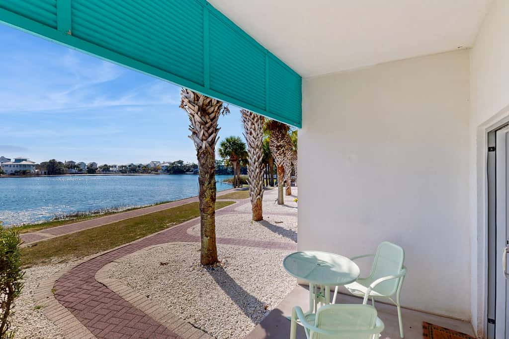 Lakefront dog-friendly condo with water views, pool, hot tub & beach access