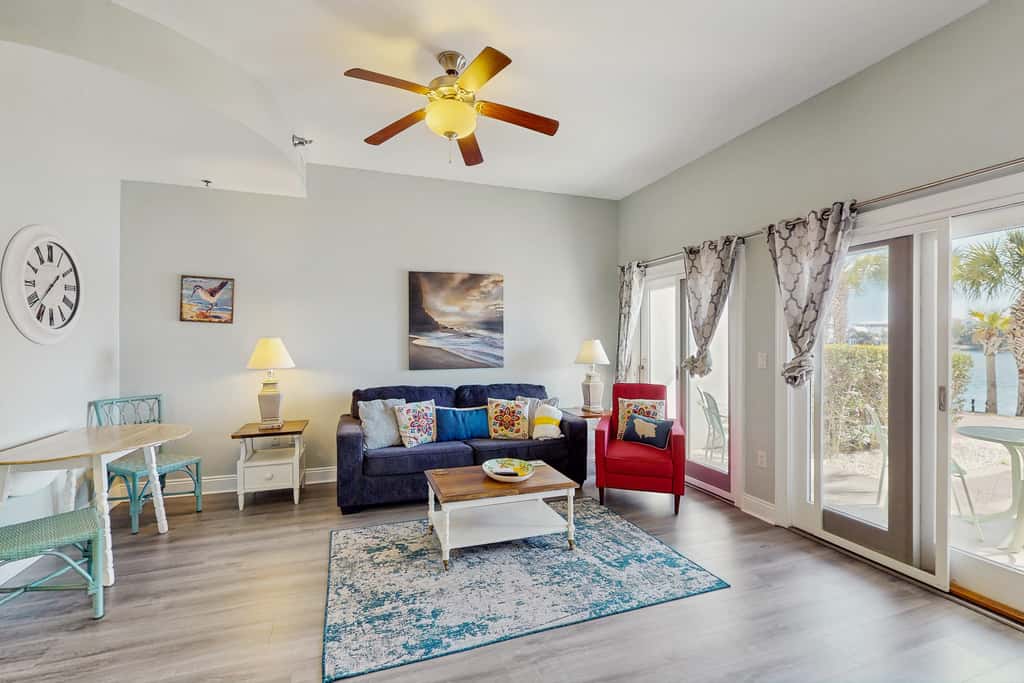 Lakefront dog-friendly condo with water views, pool, hot tub & beach access