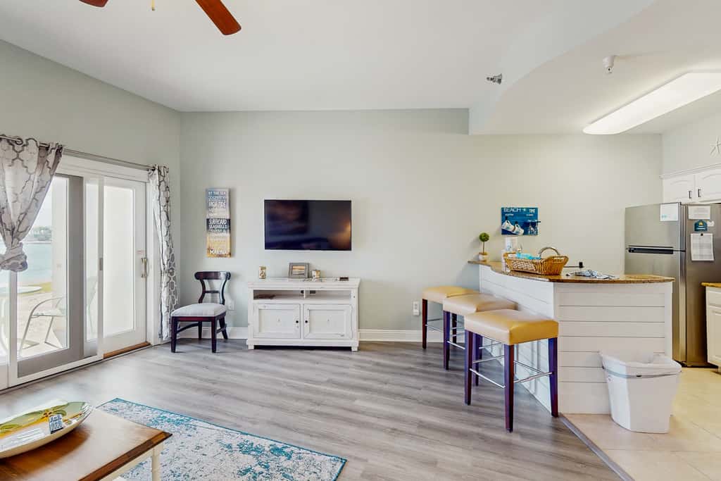 Lakefront dog-friendly condo with water views, pool, hot tub & beach access