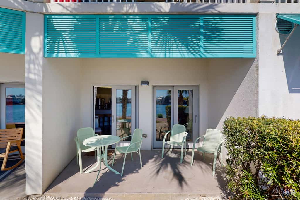 Lakefront dog-friendly condo with water views, pool, hot tub & beach access