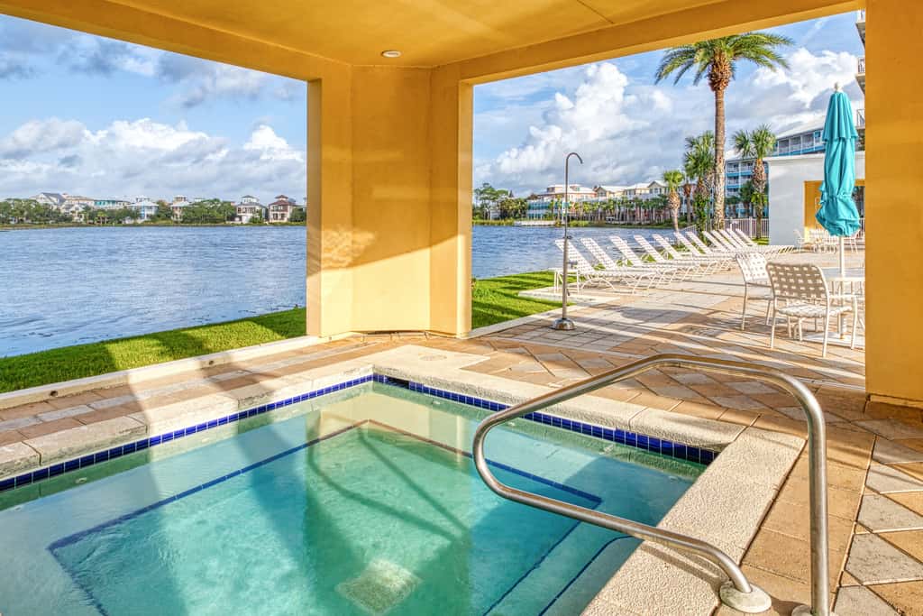 Lakefront dog-friendly condo with water views, pool, hot tub & beach access