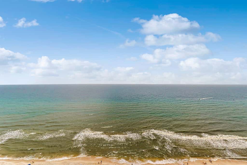 Roomy retreat on the water with private balcony, shared pool, & beach access