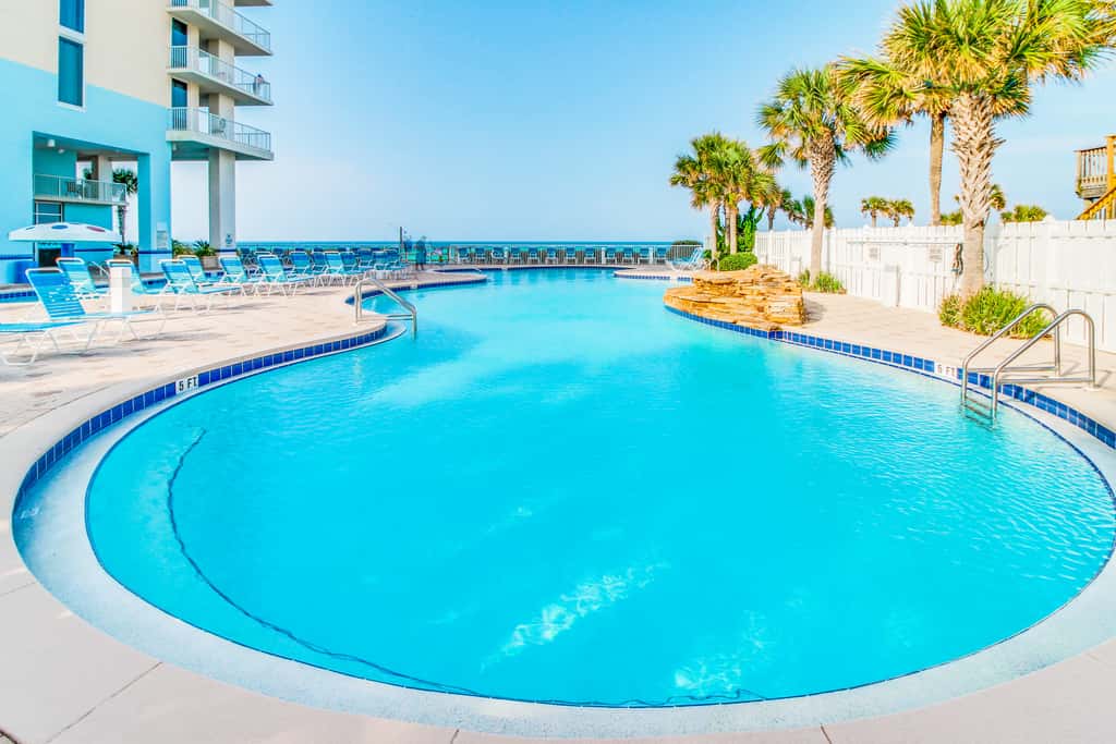 Sun-soaked oceanfront escape with pool, hot tub, central AC, & tennis court