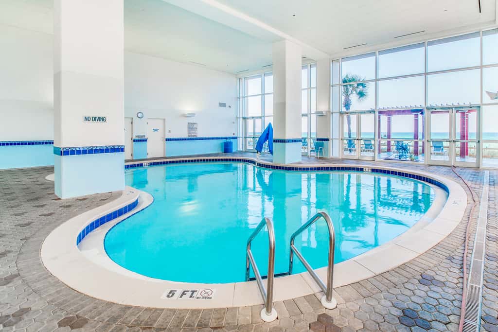Sun-soaked oceanfront escape with pool, hot tub, central AC, & tennis court