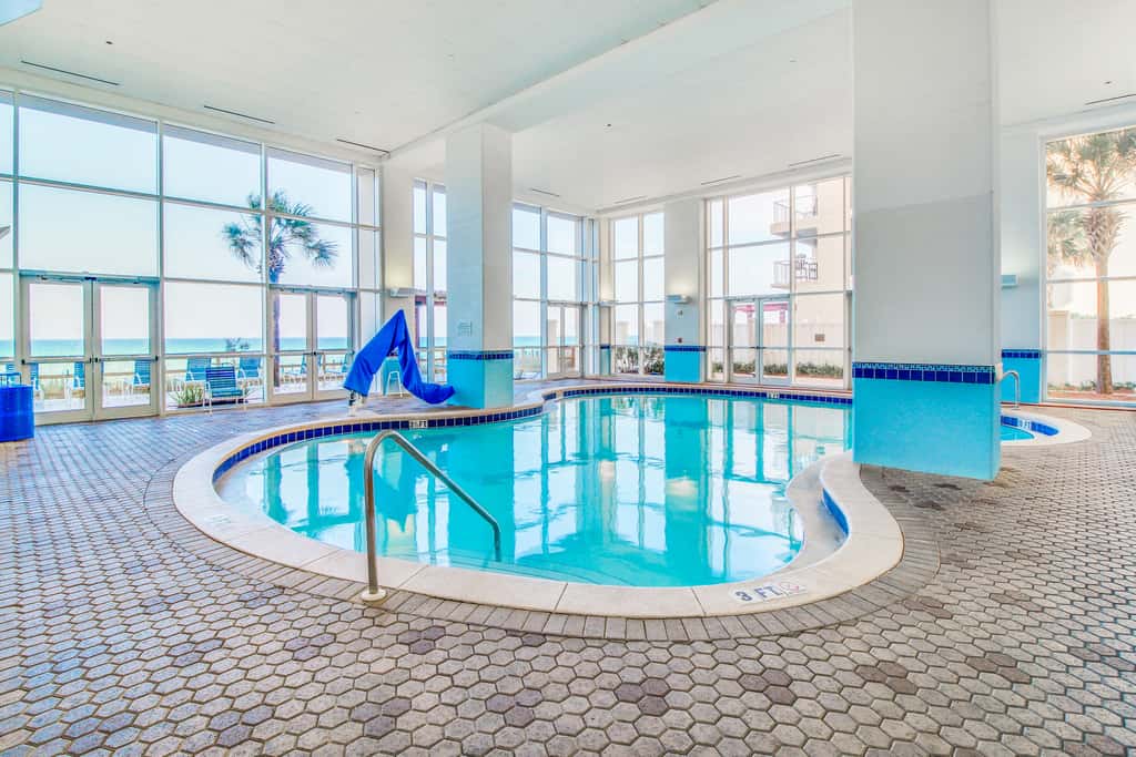 Sun-soaked oceanfront escape with pool, hot tub, central AC, & tennis court