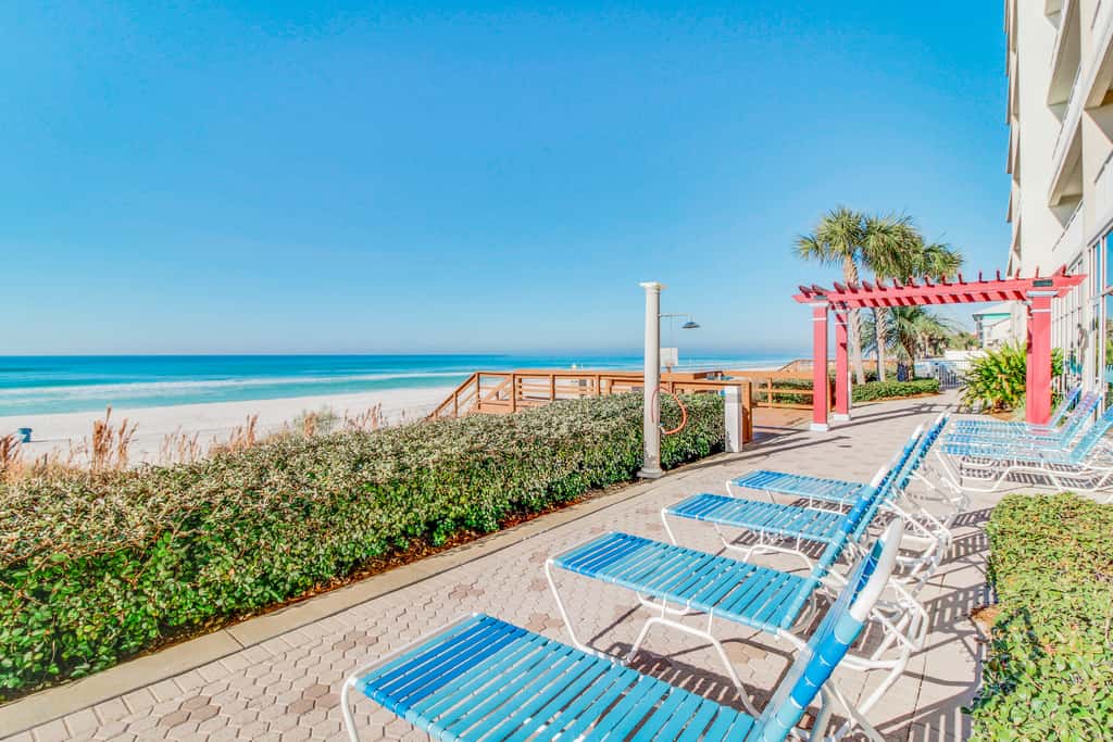 Sun-soaked oceanfront escape with pool, hot tub, central AC, & tennis court