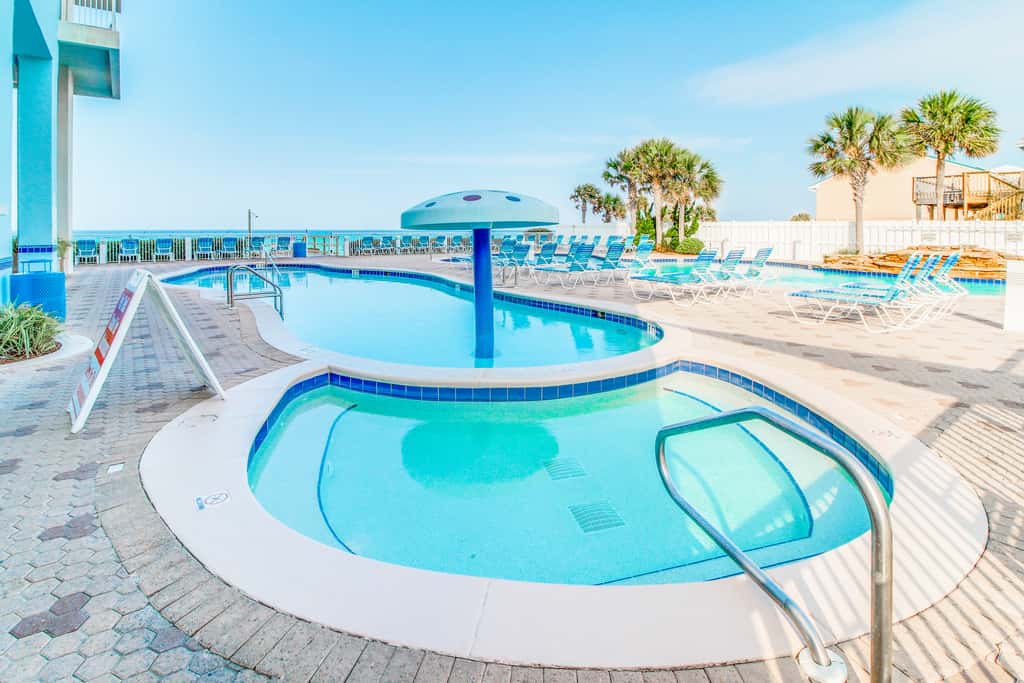 Sun-soaked oceanfront escape with pool, hot tub, central AC, & tennis court