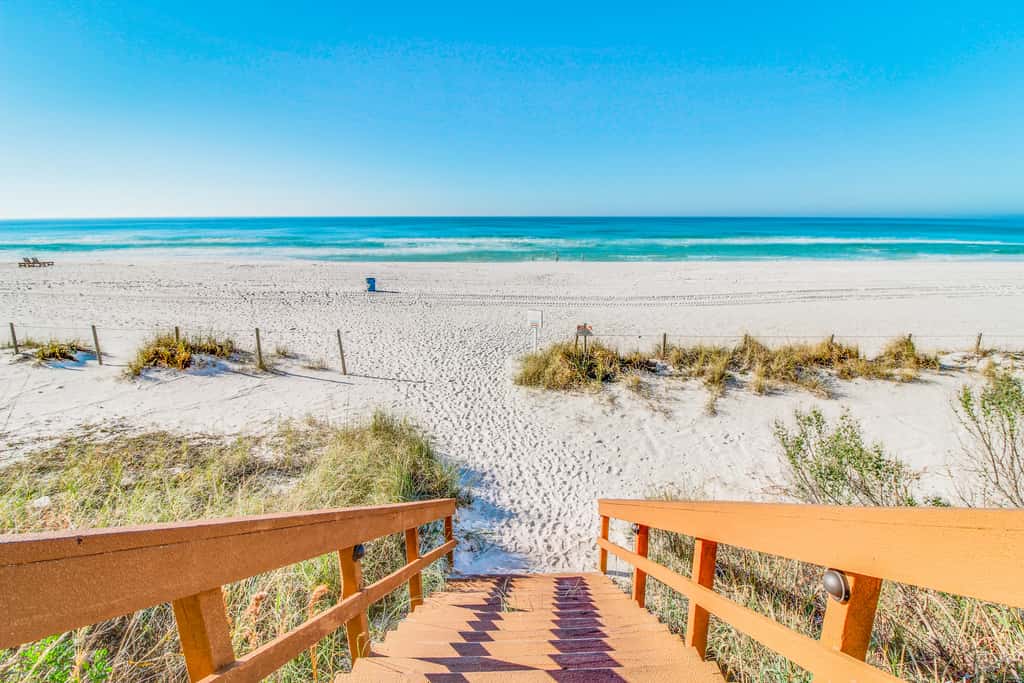 Sun-soaked oceanfront escape with pool, hot tub, central AC, & tennis court